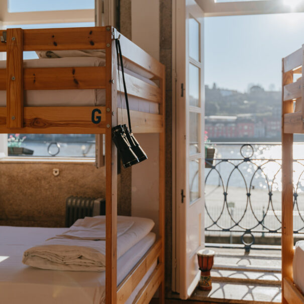Bed in 10-bed mixed community room with river view at Happy Porto Hostel – cheap hostel Porto